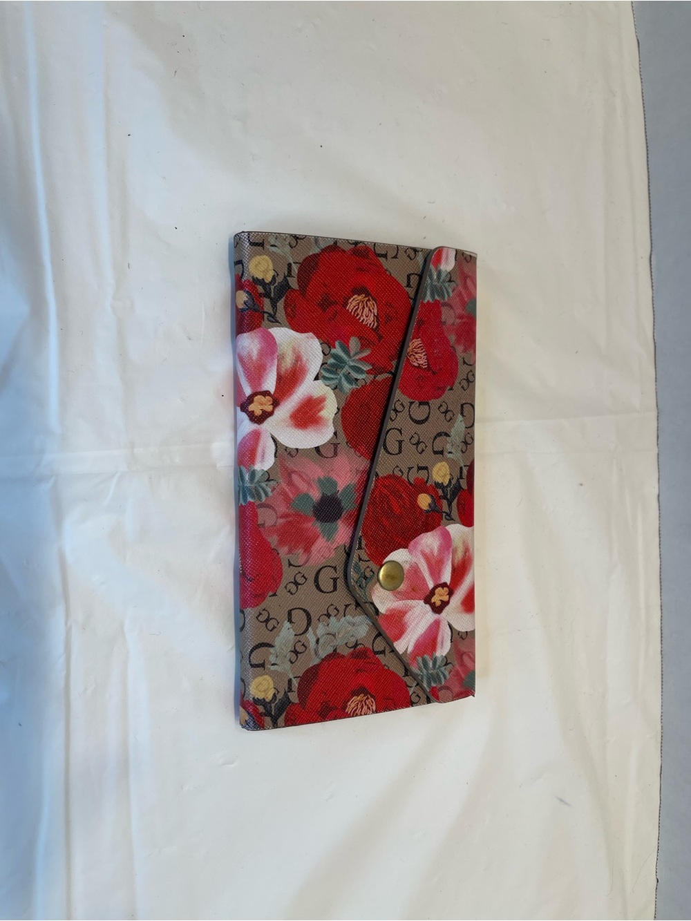 Guess foldable sunglasses case with GG floral design